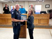 Arkansas City Police Chief Eric Burr Presents Good Neighbor Award to Samantha Koester