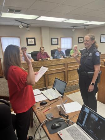During the July 5 City Commission meeting City Clerk Tiffany Parsons swears in Arkansas City Police Officer Shawntele Crownover.